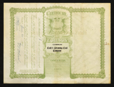 Backside shows light green ink with an intricate border and legal language with dates and signatures