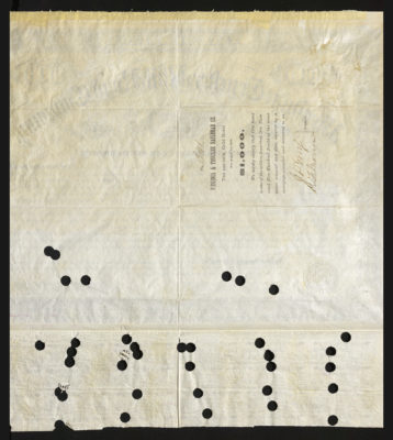 Backside shows legal language including spacing for signatures and dates and various holes punched out