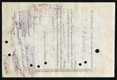 Backside shows various legal language including signatures, dates, and various colored stamps