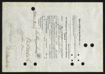 Backside shows various legal language including signatures and dates and punched out holes