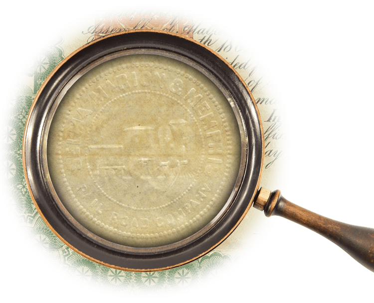 Magnifying glass over an embossed logo for the company with a locomotive in the center